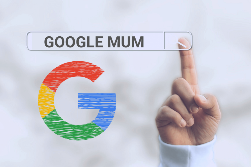 Hand die auf Google-Suchleiste zeigt, in der Google Mum steht